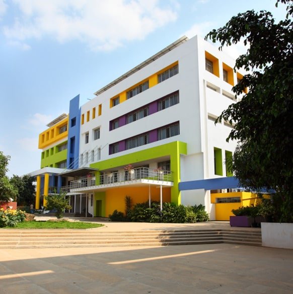 abbssm College campus with students, buildings, and greenery