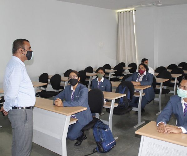 People wearing masks, maintaining social distance, and staying safe during the pandemic.