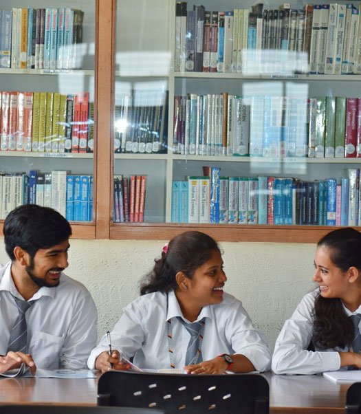 Teacher guiding students in a classroom, demonstrating effective pedagogy